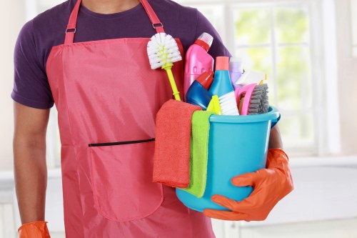 Technician wearing PPE while performing carpet cleaning in Wembley
